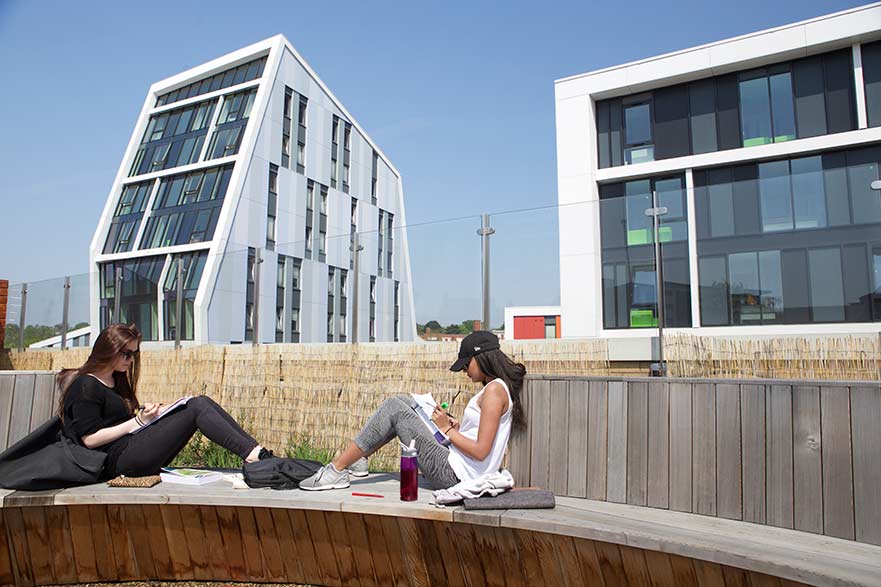 students on boots library roof top
